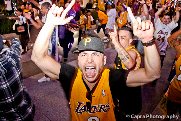 They're like locusts I tell ya... a plague upon society... I mean look at this guy... Pirates hat and Lakers Jersey?? PICK A SIDE DAMN YOU!!! Disgusting. (Photo Credit, Susana Capra)