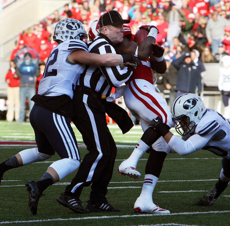 BYU wouldn't get bowled over in the Big 12 because they don't let anyone stand in their way... not even the refs... image via http://www.deseretnews.com/article/865590303/BYUs-Hoffman-scores-2-touchdowns-breaks-another-record.html?pg=all